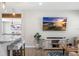 Open-concept living space showcasing a cozy seating area and bar seating to the kitchen area at 4105 W Fair Oaks Ave, Tampa, FL 33611