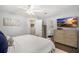 Bright main bedroom with en-suite bathroom, TV and neutral decor at 4105 W Fair Oaks Ave, Tampa, FL 33611