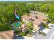 Beautiful aerial view of the condo complex and swimming pool, surrounded by lush greenery and landscaping at 4206 Preserve Pl, Palm Harbor, FL 34685