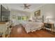 Primary bedroom with hardwood floors and ceiling fan at 4206 Preserve Pl, Palm Harbor, FL 34685