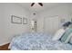 Cozy bedroom featuring a comfortable bed with stylish blue bedding and ample natural light at 4206 Preserve Pl, Palm Harbor, FL 34685