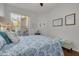Comfortable bedroom with sliding glass doors leading to outdoor patio seating at 4206 Preserve Pl, Palm Harbor, FL 34685