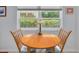Bright breakfast nook featuring a wood table set in front of a large, bright window with natural light at 4206 Preserve Pl, Palm Harbor, FL 34685