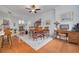 Formal dining room featuring hardwood floors and large windows for lots of natural light at 4206 Preserve Pl, Palm Harbor, FL 34685