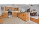 Beautiful kitchen features granite countertops, stainless steel appliances, and a breakfast bar at 4206 Preserve Pl, Palm Harbor, FL 34685