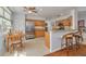 Bright kitchen featuring light wood cabinetry, stainless steel appliances, and a breakfast nook at 4206 Preserve Pl, Palm Harbor, FL 34685