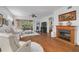 Bright living room boasts hardwood floors, fireplace and sliding glass door leading to the lanai at 4206 Preserve Pl, Palm Harbor, FL 34685