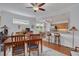Open concept living space with dining and breakfast nook areas with hardwood floors throughout at 4206 Preserve Pl, Palm Harbor, FL 34685