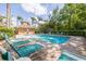 Community pool featuring ample seating and a nearby cabana area, ideal for socializing and relaxation at 4206 Preserve Pl, Palm Harbor, FL 34685