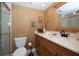 Warm and inviting bathroom featuring earth-toned wallpaper, modern vanity and a glass-enclosed shower at 4910 Bay Ne St # 308, St Petersburg, FL 33703