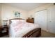 Serene bedroom with soft lighting featuring an ornate bed frame and stylish furnishings at 4910 Bay Ne St # 308, St Petersburg, FL 33703