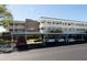Exterior view of condo building, showing parking spaces and covered parking spots at 4910 Bay Ne St # 308, St Petersburg, FL 33703