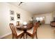 Dining area showcasing a round table with chairs, adjacent to a well-lit living room at 4910 Bay Ne St # 308, St Petersburg, FL 33703