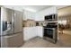 Bright kitchen featuring stainless steel appliances, ample cabinet space, and tile flooring at 4910 Bay Ne St # 308, St Petersburg, FL 33703
