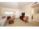 Bright living room featuring neutral tones, comfortable seating, and a view to the bedroom at 4910 Bay Ne St # 308, St Petersburg, FL 33703