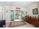 Bright room with sliding doors to patio, rug and a rocking chair at 4910 Bay Ne St # 308, St Petersburg, FL 33703