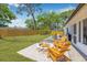 Enjoy this backyard with a fire pit, lots of room to entertain, and a wooden fence for privacy at 4925 Camellia S Way, St Petersburg, FL 33705