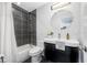 Updated bathroom featuring black tile in tub and modern fixtures at 4925 Camellia S Way, St Petersburg, FL 33705