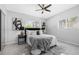 Bedroom featuring ceiling fan, gray color scheme, and modern furnishings at 4925 Camellia S Way, St Petersburg, FL 33705