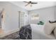 Bedroom featuring ceiling fan, modern furnishings, and sliding door closet at 4925 Camellia S Way, St Petersburg, FL 33705