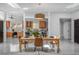 Bright dining room featuring a modern chandelier, skylights, an open floorplan, and views of the kitchen at 4925 Camellia S Way, St Petersburg, FL 33705