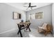 Bright home office features modern desk, ceiling fan, neutral walls and an abundance of natural light at 4925 Camellia S Way, St Petersburg, FL 33705