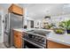 Kitchen featuring stainless steel appliances and view of the dining and living spaces at 4925 Camellia S Way, St Petersburg, FL 33705