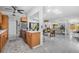 A well-lit kitchen seamlessly transitions to an open dining and living space at 4925 Camellia S Way, St Petersburg, FL 33705