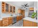 Bright kitchen with stainless steel appliances, ample counter space, and wooden cabinetry at 4925 Camellia S Way, St Petersburg, FL 33705