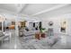 Spacious living room featuring an open floor plan, modern furnishings, and great lighting at 4925 Camellia S Way, St Petersburg, FL 33705