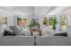 A bright living room with large windows, light colored walls, and elegant furnishings at 4925 Camellia S Way, St Petersburg, FL 33705