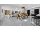 Bright living room featuring an open floor plan, modern furnishings, and combined dining area at 4925 Camellia S Way, St Petersburg, FL 33705