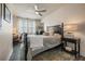 Cozy bedroom features a ceiling fan and desk by the window at 5 Island Park Pl # 305, Dunedin, FL 34698