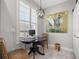 Cozy breakfast nook features a modern light fixture and charming heron artwork at 5 Island Park Pl # 305, Dunedin, FL 34698