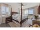 Serene main bedroom with a four-poster bed offers partial ocean views from the balcony at 5 Island Park Pl # 305, Dunedin, FL 34698