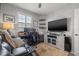 Well-lit office space featuring a large television and comfortable seating at 5 Island Park Pl # 305, Dunedin, FL 34698