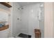 Modern walk-in shower featuring a rainfall shower head and white tile at 5 Island Park Pl # 305, Dunedin, FL 34698