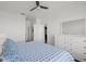 This bedroom has white walls and trim, and a white dresser next to the bed and a view to a bathroom at 5000 Culbreath Key Way # 8-308, Tampa, FL 33611