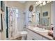 Bathroom with tub/shower and a vanity with a sink and decorative wreath at 5137 Epping Ln, Zephyrhills, FL 33541