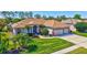 Well maintained, landscaped two-story home with three-car garage and brick driveway at 5137 Epping Ln, Zephyrhills, FL 33541