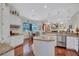Bright kitchen features a center island, stainless steel appliances, and an adjacent breakfast nook at 5137 Epping Ln, Zephyrhills, FL 33541