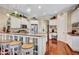 Gourmet kitchen with granite countertops, stainless steel appliances, and an integrated breakfast bar at 5137 Epping Ln, Zephyrhills, FL 33541