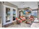 Comfortable screened lanai with plush seating and a view of the swimming pool, perfect for relaxation at 5137 Epping Ln, Zephyrhills, FL 33541