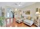 Inviting living room with hardwood floors, stylish furniture, and abundant natural light at 5137 Epping Ln, Zephyrhills, FL 33541