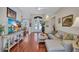 Open living room with hardwood floors, stylish furniture, and elegant decor accents at 5137 Epping Ln, Zephyrhills, FL 33541