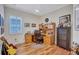 Well-lit home office with built-in desk, window, and hardwood flooring at 5137 Epping Ln, Zephyrhills, FL 33541