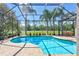 Stunning screened pool area with lush landscaping and beautiful view of golf course in the backyard at 5137 Epping Ln, Zephyrhills, FL 33541