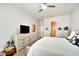 Spacious bedroom with white furniture, large bed, and well placed TV at 527 Manns Harbor Dr, Apollo Beach, FL 33572