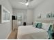 Comfortable bedroom featuring a ceiling fan, shuttered windows, and a serene color palette at 527 Manns Harbor Dr, Apollo Beach, FL 33572
