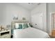 Serene bedroom with soft lighting, comfortable bedding, and convenient closet space at 527 Manns Harbor Dr, Apollo Beach, FL 33572
